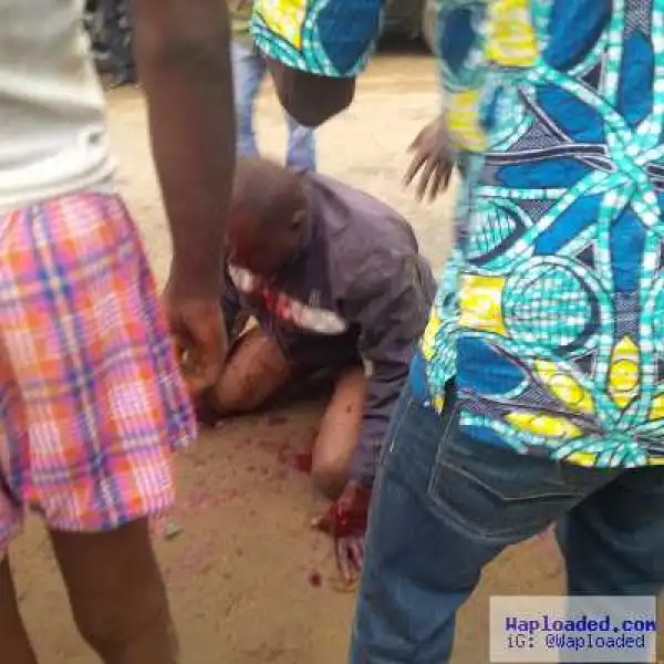 Graphic Photos: Child Kidnapper Almost Beaten To Death In Lagos